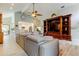 Spacious living room with a large media center and open access to the modern kitchen at 3089 Enisglen Dr, Palm Harbor, FL 34683