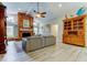 Inviting living room showcasing brick fireplace, wood floors, neutral colors and an entertainment center at 3089 Enisglen Dr, Palm Harbor, FL 34683
