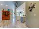 Open-concept room showcasing a built-in cabinet and a modern kitchen at 3089 Enisglen Dr, Palm Harbor, FL 34683