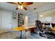 Bright office with wood floors, built-in desk and shelves, with map decor at 3089 Enisglen Dr, Palm Harbor, FL 34683