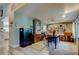 Bright office features built-in bookcase, wood floors, large window, ceiling fan and comfortable leather chair at 3089 Enisglen Dr, Palm Harbor, FL 34683