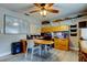 Bright office with wood floors, built-in desk and shelves, with map decor at 3089 Enisglen Dr, Palm Harbor, FL 34683
