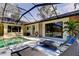 Backyard pool with an inviting lounge area is perfect for enjoying sunny days in this private backyard at 3089 Enisglen Dr, Palm Harbor, FL 34683