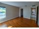 Hardwood floors and natural light in this room with an ensuite and closet view at 3298 Buckhorn Dr, Clearwater, FL 33761