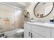 Modern bathroom with a toilet, shower with glass doors, and a stylish vanity at 3401 Killdeer Pl, Palm Harbor, FL 34685