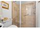Bathroom shower with beautiful tile and glass door at 3401 Killdeer Pl, Palm Harbor, FL 34685