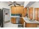 Spacious kitchen boasts ample cabinet space, stainless steel appliances, and white countertops at 3401 Killdeer Pl, Palm Harbor, FL 34685