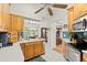 Inviting kitchen area with wood cabinets, stainless appliances, and an eat-in dining area at 3401 Killdeer Pl, Palm Harbor, FL 34685