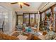 Cozy sunroom with wicker furniture and plenty of natural light at 3401 Killdeer Pl, Palm Harbor, FL 34685