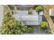 Aerial view shows the home's roof and surrounding greenery at 37321 8Th Ave, Zephyrhills, FL 33542