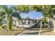 Charming single-story home with a covered carport and landscaped front yard at 37321 8Th Ave, Zephyrhills, FL 33542