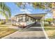 Charming single-story home boasts a covered carport and well-maintained landscaping at 37321 8Th Ave, Zephyrhills, FL 33542