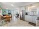 Open-concept kitchen and dining area with stainless steel appliances and lots of light at 37321 8Th Ave, Zephyrhills, FL 33542