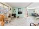 Inviting living room with a large window, light walls, and views to the dining area at 37321 8Th Ave, Zephyrhills, FL 33542