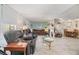 Expansive living room featuring an open floor plan, neutral decor, and updated flooring at 37321 8Th Ave, Zephyrhills, FL 33542