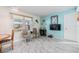 Comfortable living room with neutral walls, a large window, and updated flooring at 37321 8Th Ave, Zephyrhills, FL 33542