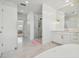 Bathroom showcases a glass enclosed shower, vanity with marble countertop, and a soaking tub at 4610 W Browning Ave, Tampa, FL 33629