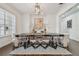 Dining room showcasing table with clear chairs, a modern chandelier, and a stylish rug at 4610 W Browning Ave, Tampa, FL 33629