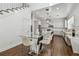 Eat-in kitchen has a glass-top table, white cabinets, and stainless-steel appliances at 4610 W Browning Ave, Tampa, FL 33629
