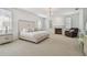 Spacious main bedroom with a fireplace, plush carpet, and a sitting area by the window at 4610 W Browning Ave, Tampa, FL 33629
