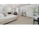 Bright and airy main bedroom with carpet, fireplace, piano, vanity, and sitting area at 4610 W Browning Ave, Tampa, FL 33629
