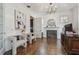 Home office features a fireplace, hardwood floors, modern art, and neutral-colored walls at 4610 W Browning Ave, Tampa, FL 33629