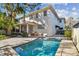 Exterior shot of home featuring a private pool and patio area at 4610 W Browning Ave, Tampa, FL 33629