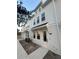 Three-story townhome with white siding and a modern design at 4717 W Mccoy St # 6, Tampa, FL 33616