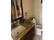 Bathroom featuring granite countertops, dark wood cabinets, and modern fixtures at 5086 Barrington Cir # 3201, Sarasota, FL 34234