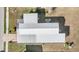 Aerial view of the roof and yard, including the American flag on the property at 5538 Antigua Dr, Zephyrhills, FL 33541