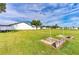 This spacious backyard includes a horseshoe court, lawn, and an equipment trailer at 5538 Antigua Dr, Zephyrhills, FL 33541