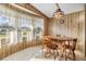 Cozy dining area with a wooden table set and natural light streaming through the windows at 5538 Antigua Dr, Zephyrhills, FL 33541