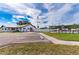 Exterior of the community building, showing a well-maintained parking area and picnic area at 5538 Antigua Dr, Zephyrhills, FL 33541