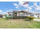 Inviting single-story home with covered parking, complete with neat front yard landscaping at 5538 Antigua Dr, Zephyrhills, FL 33541