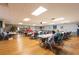 Community activity room featuring tables, chairs, and a cozy atmosphere at 5538 Antigua Dr, Zephyrhills, FL 33541