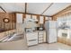Well-lit kitchen features a full suite of appliances, wood accents, and ample cabinet space at 5538 Antigua Dr, Zephyrhills, FL 33541
