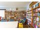 Well-stocked community library featuring bookshelves filled with books and cozy seating at 5538 Antigua Dr, Zephyrhills, FL 33541