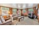 Comfortable living room featuring wall paneling and lots of natural light at 5538 Antigua Dr, Zephyrhills, FL 33541