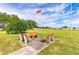 This outdoor space in the community park includes benches with views of the open green space at 5538 Antigua Dr, Zephyrhills, FL 33541