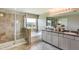 Modern bathroom featuring dual sinks, a walk-in shower, and a separate tub at 5636 Silver Moonlight Dr, Palmetto, FL 34221