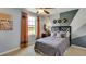 Stylish bedroom with unique wall decor, comfortable bed, and ample natural light at 5636 Silver Moonlight Dr, Palmetto, FL 34221