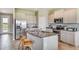 Bright kitchen features stainless appliances, granite counters, and center island with seating at 5636 Silver Moonlight Dr, Palmetto, FL 34221