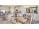 Modern kitchen with stainless steel appliances open to an adjacent dining area at 5636 Silver Moonlight Dr, Palmetto, FL 34221