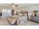 Elegant main bedroom featuring a comfortable bed, stylish furnishings, and ample space at 5636 Silver Moonlight Dr, Palmetto, FL 34221