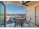 Relax on the balcony with comfortable seating and a ceiling fan, while enjoying stunning water views at 6322 Palma Del Mar S Blvd # 203, St Petersburg, FL 33715