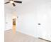 Bedroom showing an ensuite bath, updated doors, a ceiling fan, and updated flooring at 6326 22Nd N Ave, St Petersburg, FL 33710