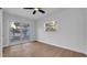 Bright bedroom featuring a sliding glass door, ceiling fan, and luxury vinyl plank flooring at 6326 22Nd N Ave, St Petersburg, FL 33710