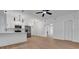 Open living space with hardwood floors, a modern kitchen and white walls at 6326 22Nd N Ave, St Petersburg, FL 33710