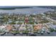 Aerial view of a lovely neighborhood with beautiful canal front homes, marking the listing at 6345 Tanglewood Ne Dr, St Petersburg, FL 33702