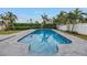 Backyard pool with stone pavers, providing a private and refreshing retreat, with plenty of space for recreation at 6345 Tanglewood Ne Dr, St Petersburg, FL 33702